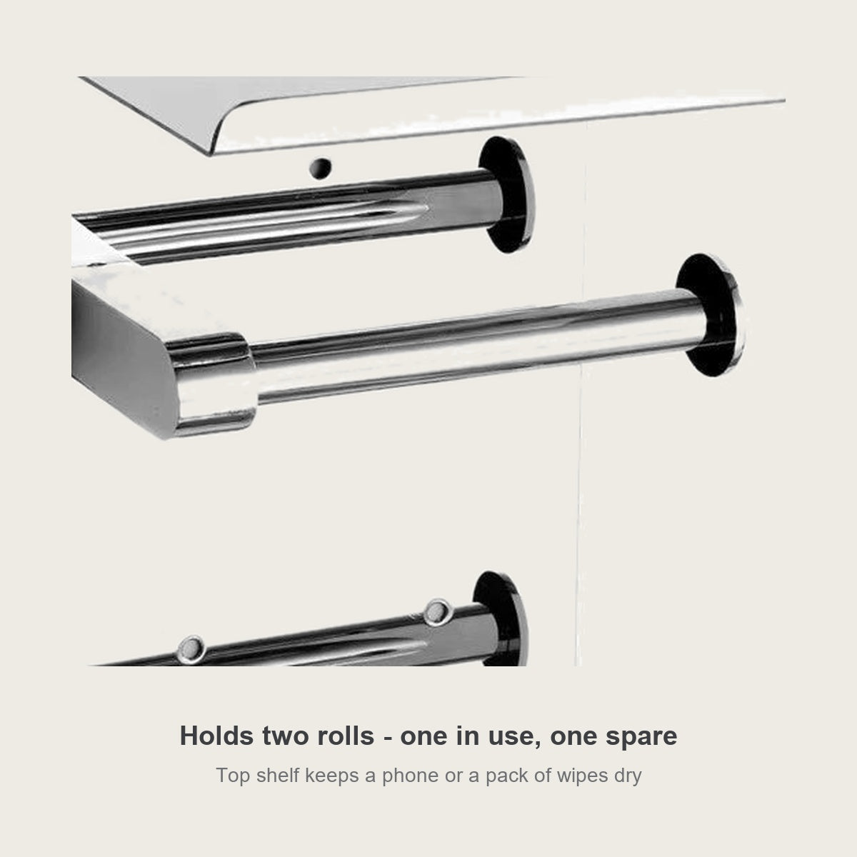 Double roll toilet paper holder close up - one roll in use, one spare