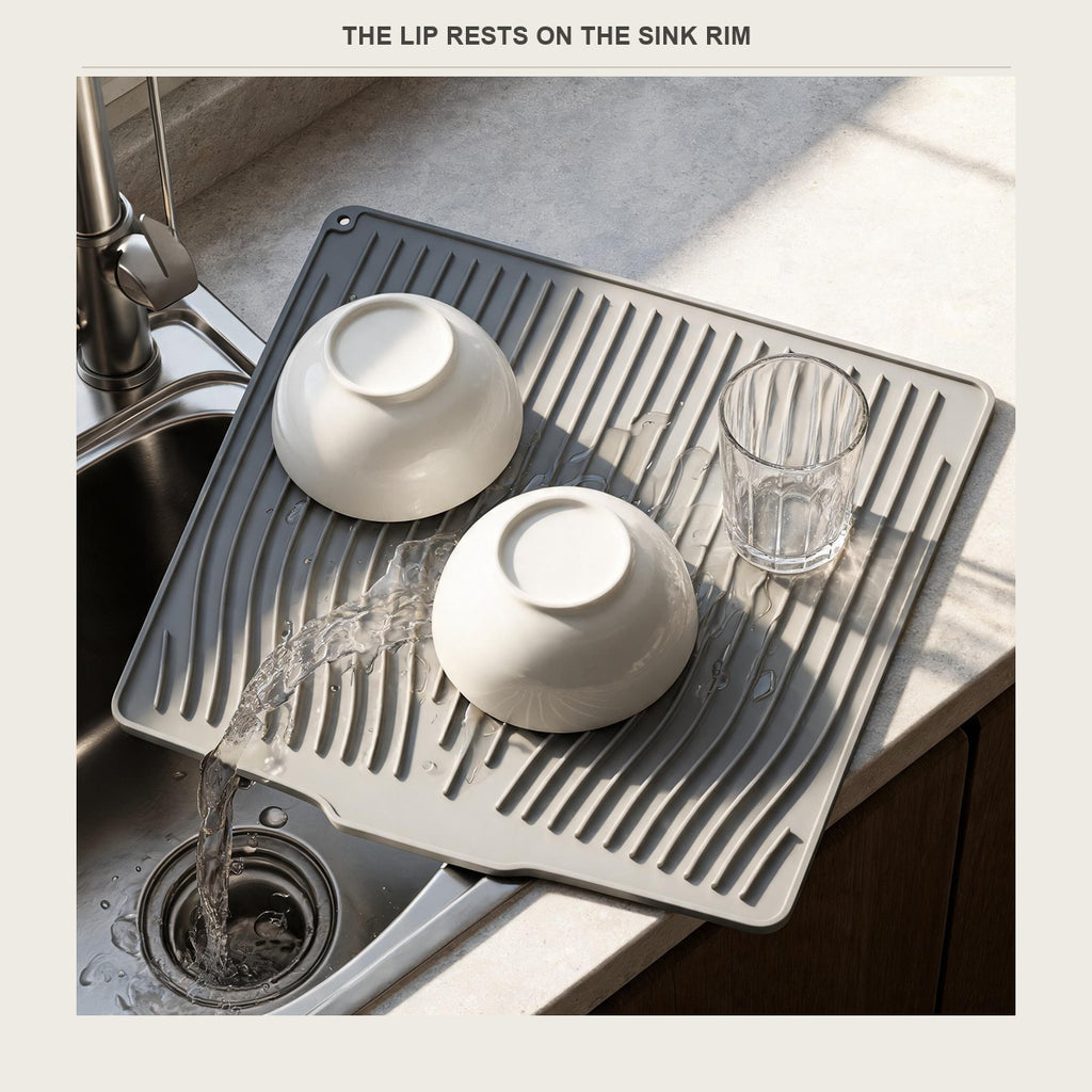 Drain lip of the dish mat resting on the sink rim
