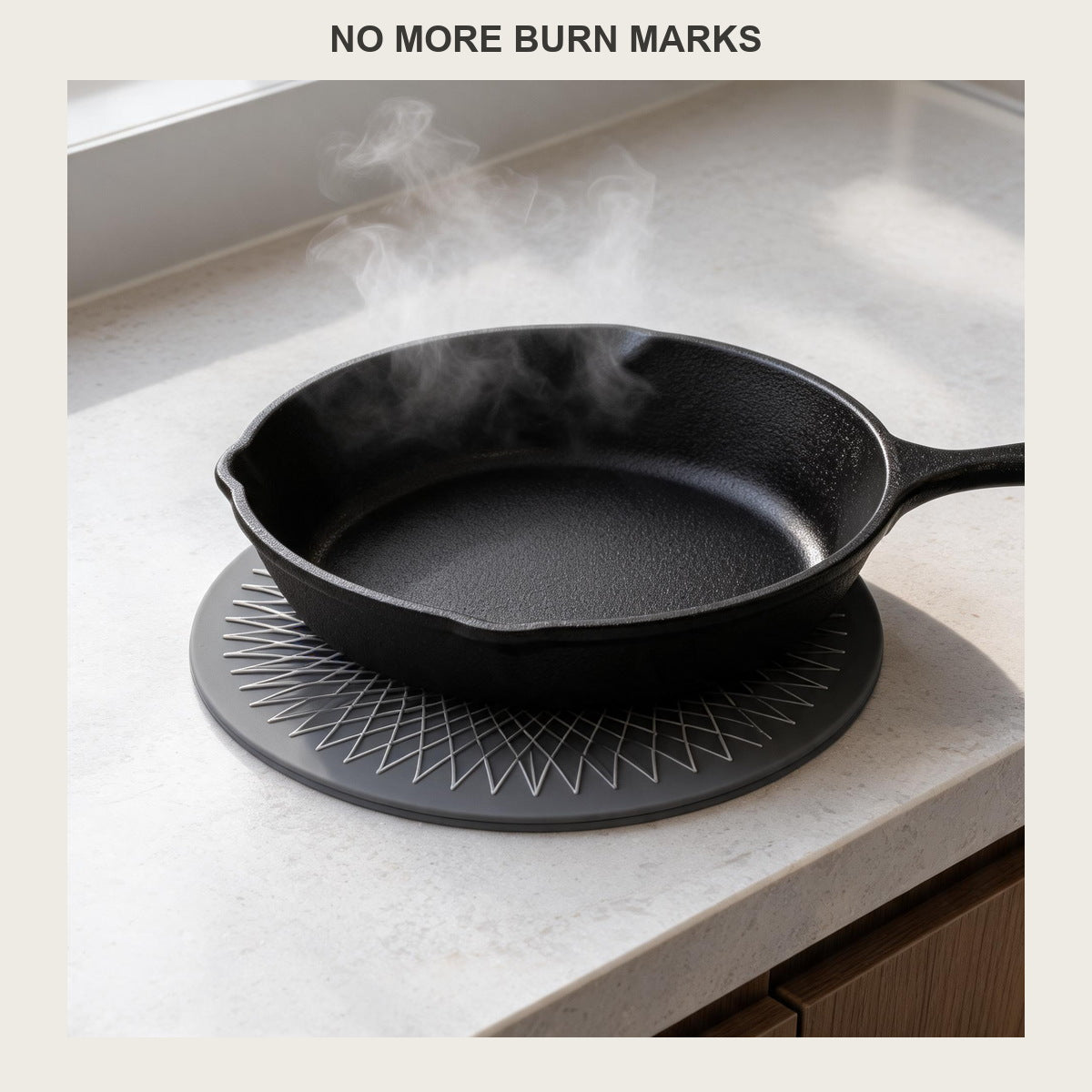 Round silicone trivet mat under a steaming black cast iron skillet on a pale quartz countertop