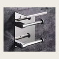 SUS304 stainless steel single roll toilet paper holder on a stone wall