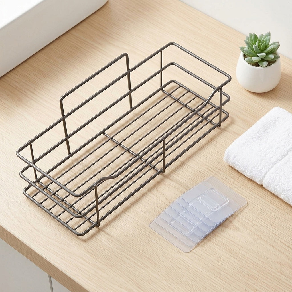 Drill-free stainless shower caddy on a vanity, lifestyle flat-lay, no people