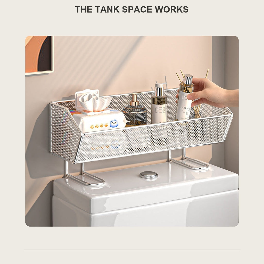 Wire over-the-toilet shelf resting on the tank lid, holding tissues and reed diffusers
