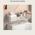 Wire over-the-toilet shelf resting on the tank lid, holding tissues and reed diffusers