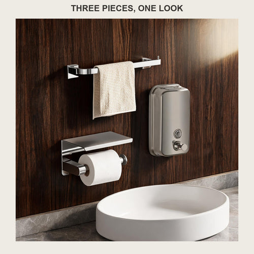 Three-piece brushed steel bathroom set on a walnut panelled wall above a white vessel basin