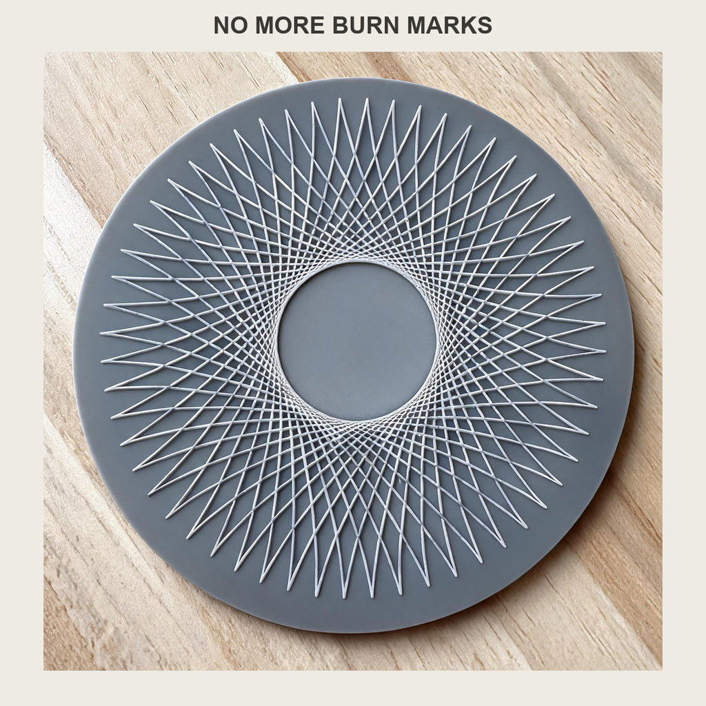 Close-up of the sunburst rib pattern and centre hole on a round silicone trivet mat