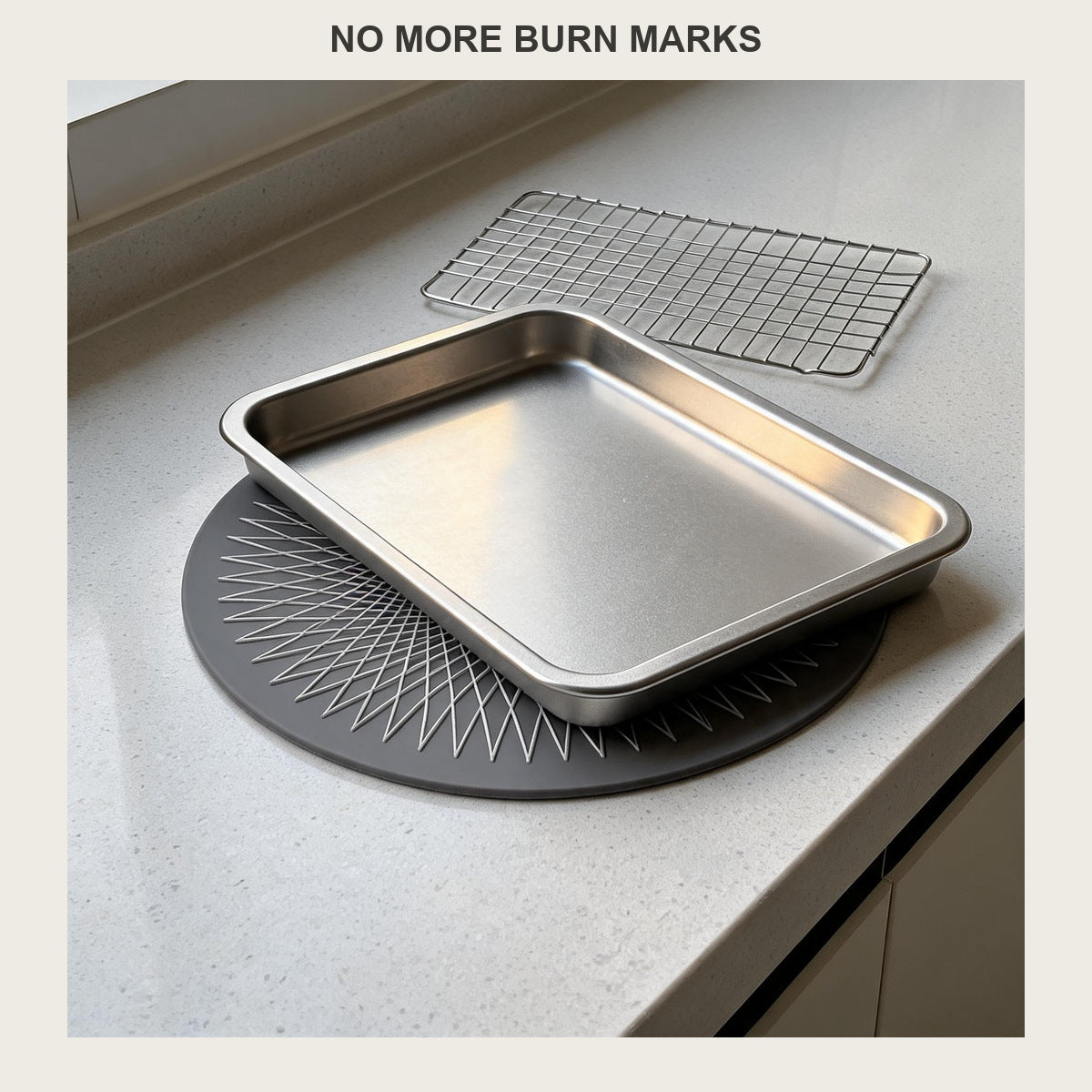Round silicone trivet mat under a metal baking sheet just out of the oven on a grey countertop