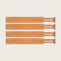 Four bamboo expandable drawer dividers with spring loaded ends