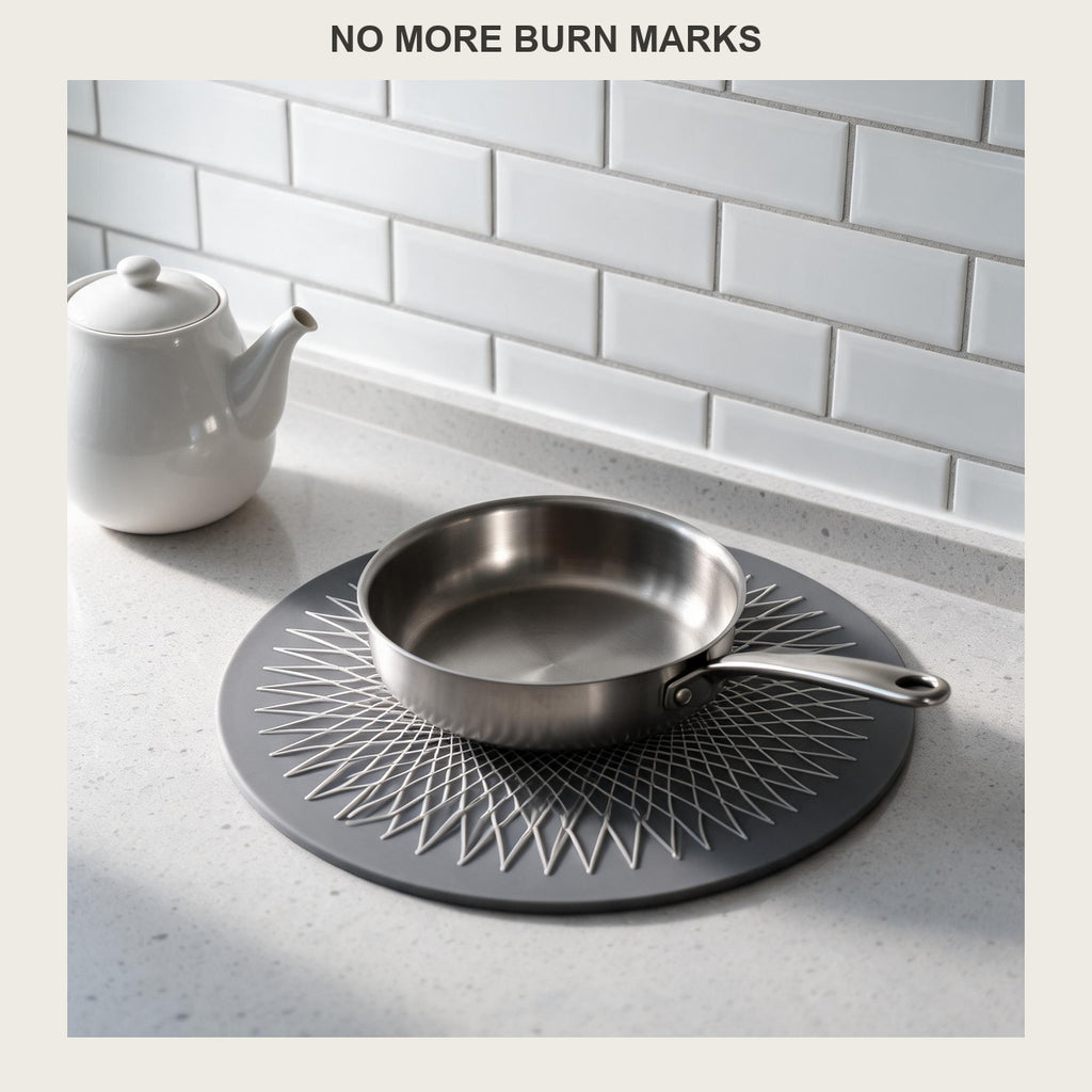 Round silicone trivet mat on a kitchen counter with a stainless pan resting on it