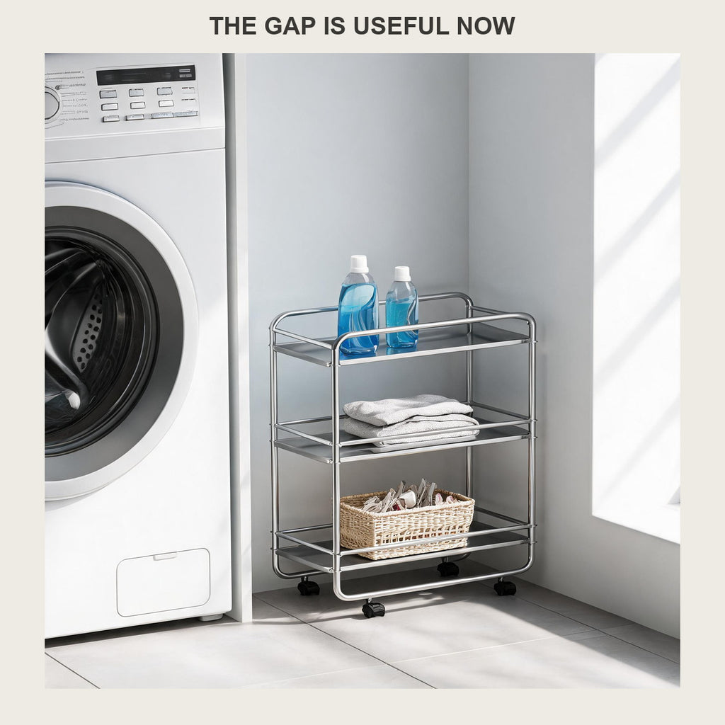 Slim three-tier rolling cart in the gap beside a white washing machine holding detergent
