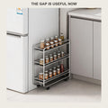 Three-tier rolling cart slotted into the narrow gap beside a white fridge, holding spice jars