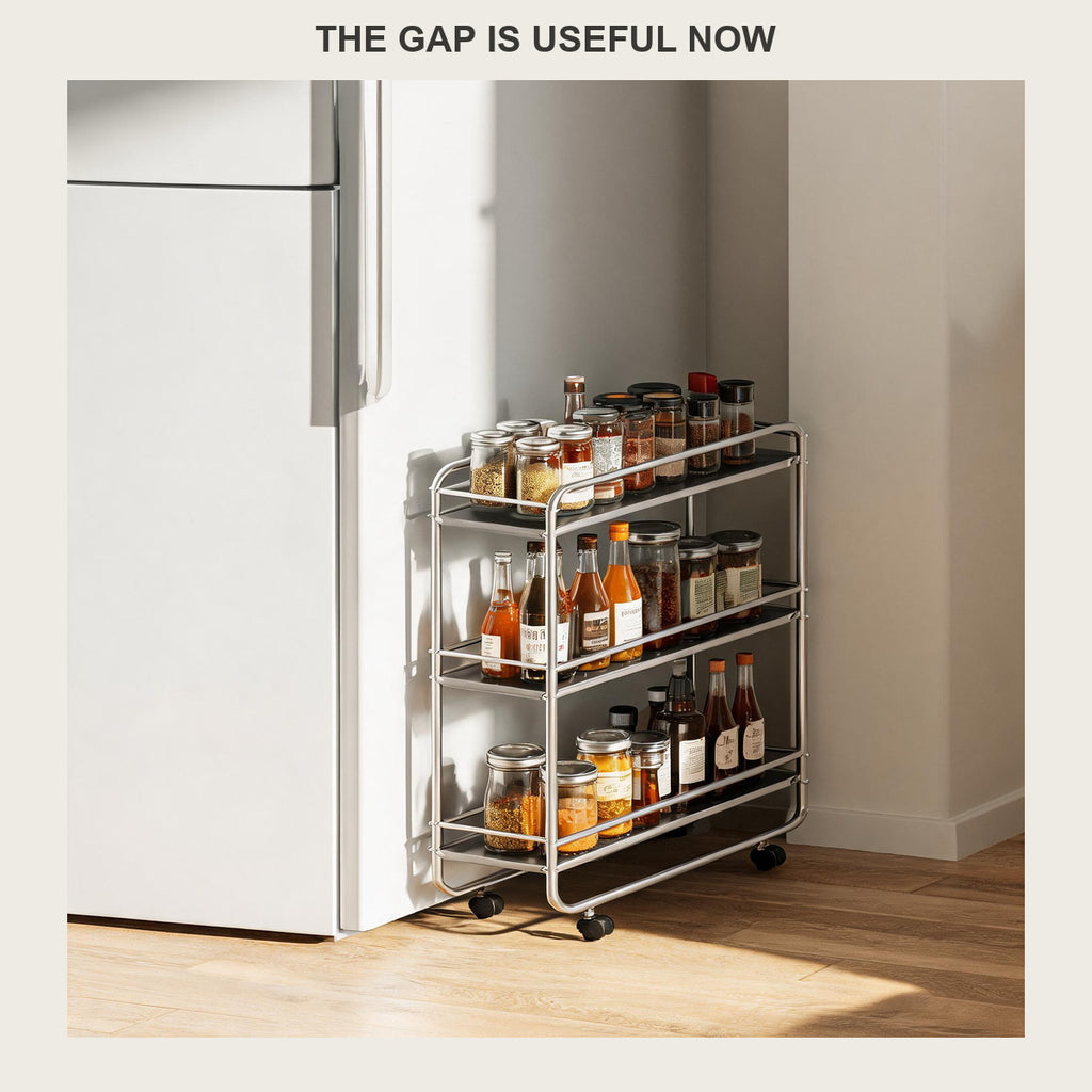Slim three-tier rolling cart pulled out of the fridge gap showing its four black castors
