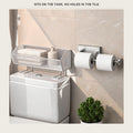 Over-the-Toilet shelf and paper holder sitting on a toilet tank lid