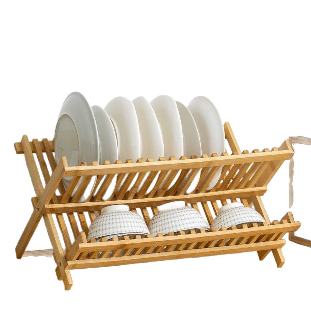 Bamboo two-tier dish rack on a white background with plates on the top tier and bowls below